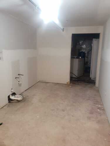 A compact restroom showcasing a toilet and a sink