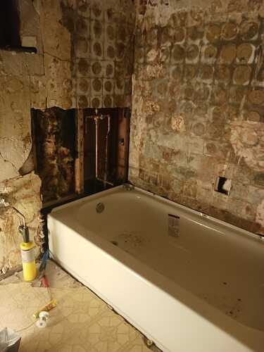 A bathroom featuring a bathtub and a toilet