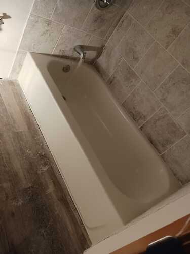 A modern bathroom featuring a sleek bathtub